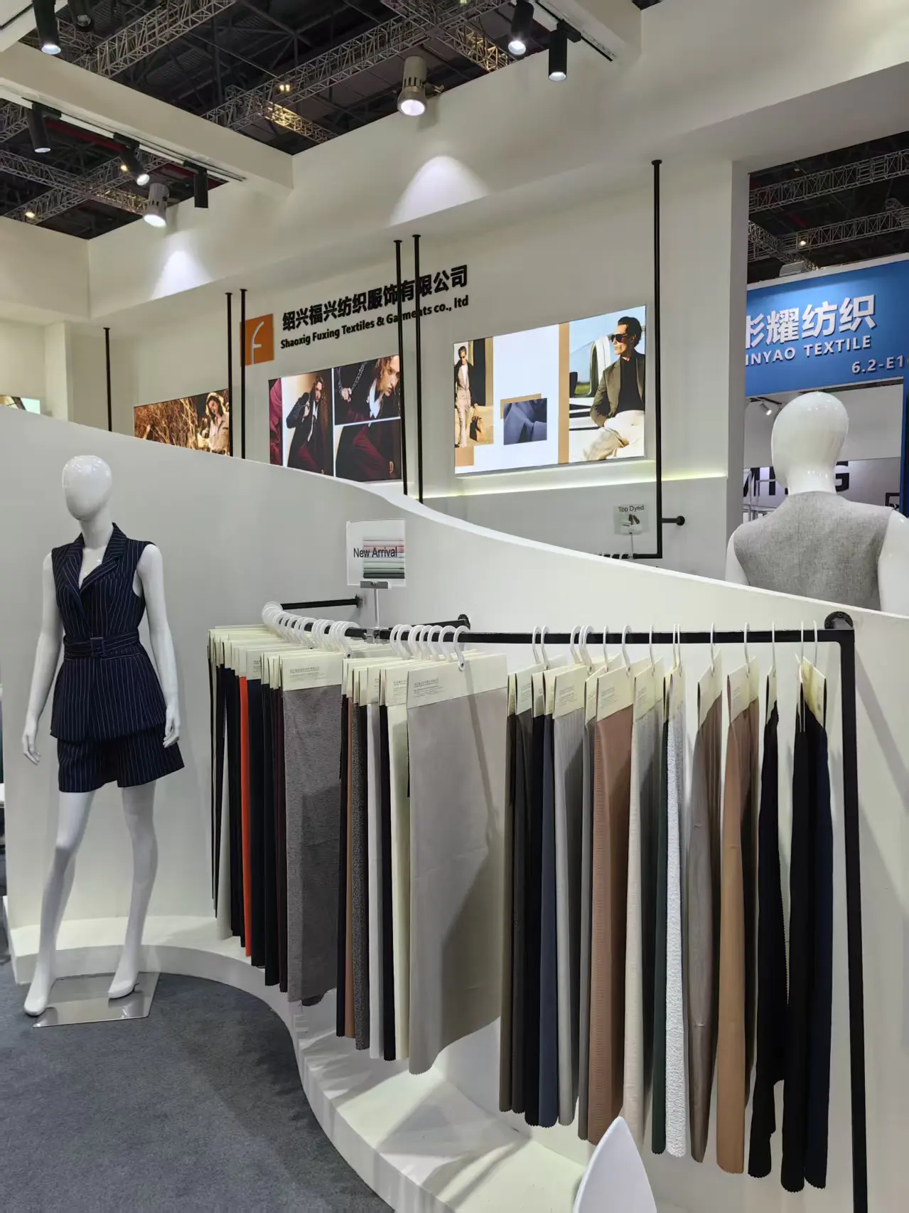 Fabric rack display inside the 푸싱 텍스타일 booth
